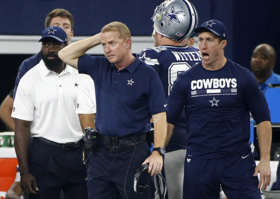 Dallas' Jason Garrett (middle) is 58-49 since 2011 as Cowboys head coach. (AP)