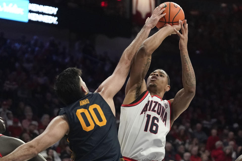 California's Fardaws Aimaq (00) blocks Arizona's Keshad Johnson (16) shot during the second half of an NCAA college basketball game Thursday, Feb. 1, 2024, in Tucson, Ariz. (AP Photo/Darryl Webb)