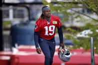 New England Patriots sixth round quarterback draft pick Joe Milton, III walks onto the field during the NFL football team's rookie minicamp Saturday, May 11, 2024, in Foxborough, Mass. (AP Photo/Mark Stockwell)