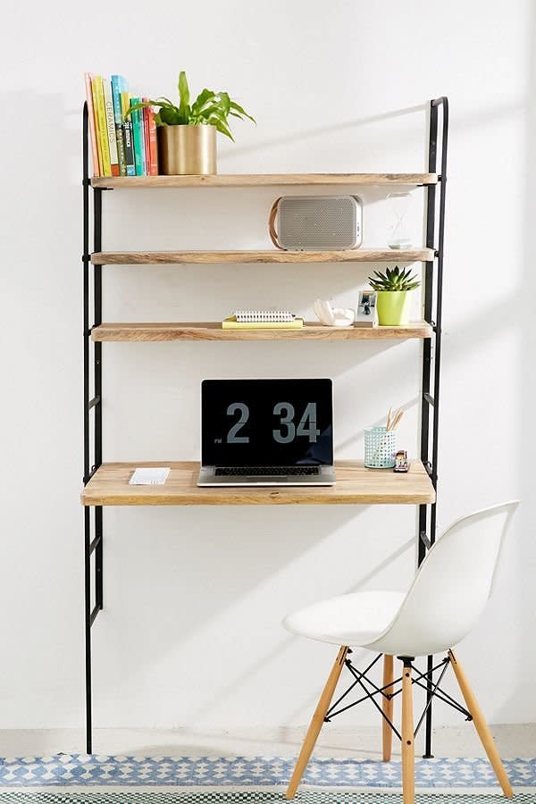 Having a large work desk is unfortunately not very feasible in a small space, but that doesn't mean you should give up on your need for a creative spot. <a href="https://www.urbanoutfitters.com/shop/cameron-adjustable-desk-storage-system?category=furniture&amp;color=001" target="_blank">This storage desk</a>&nbsp;sturdily screws right into your wall to save you space and has adjustable shelves.