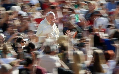 Pope Francis arrives for his weekly general audience, at the Vatican, Wednesday, Sept. 11 - Credit: AP