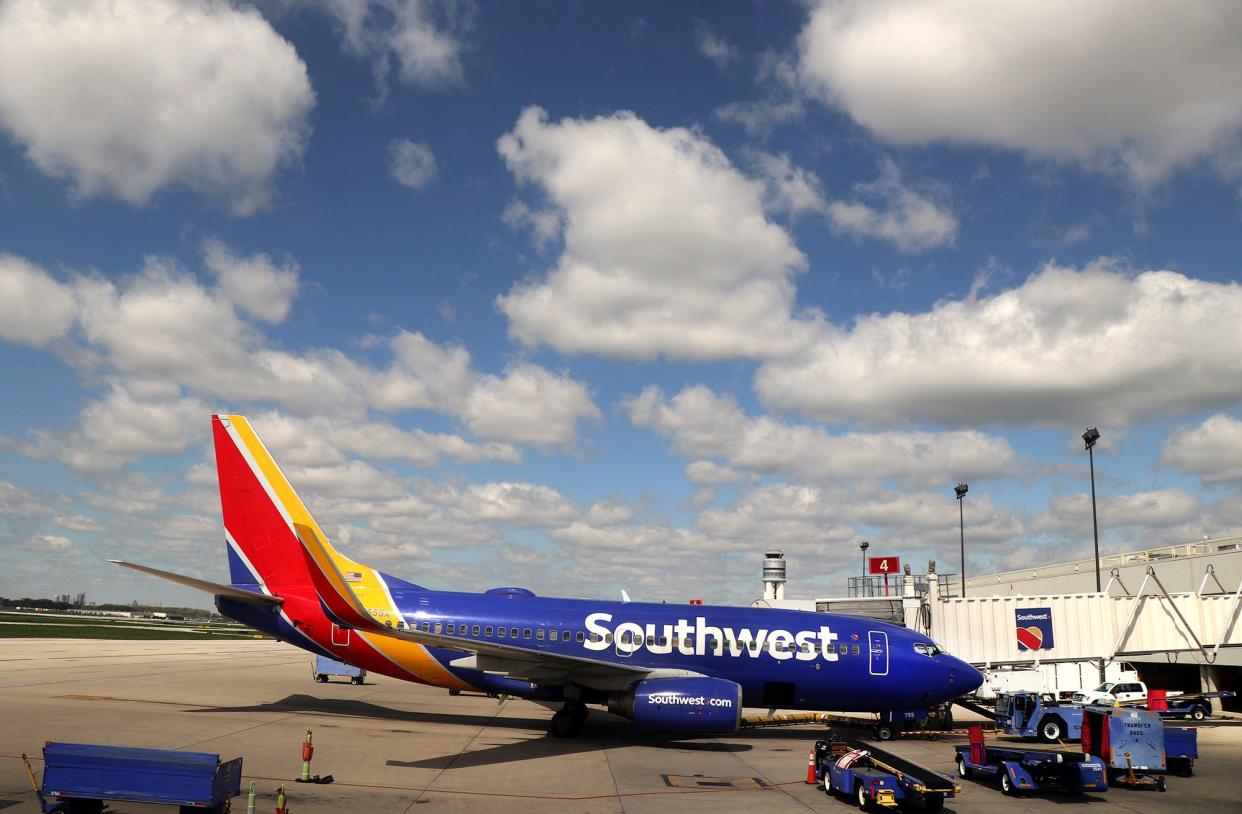 A Southwest Airlines airplane is parked at a gate at John Glenn Columbus International Airport on Monday, May 2, 2022.