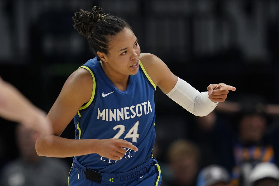 Minnesota Lynx forward Napheesa Collier (24) celebrates after making a basket during the first half of a WNBA basketball game against the Seattle Storm, Tuesday, June 27, 2023, in Minneapolis. (AP Photo/Abbie Parr)