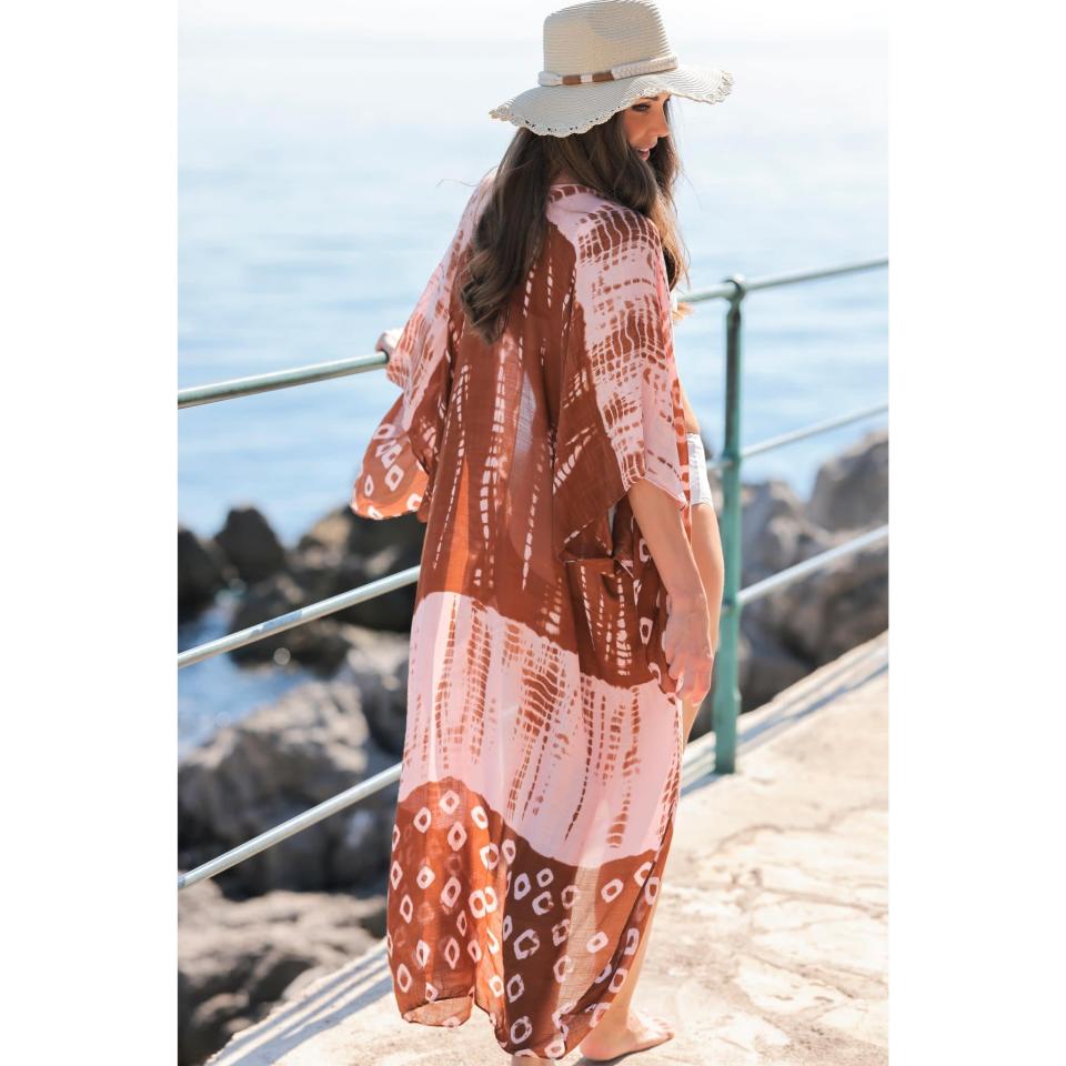 <p>The <span>Shiraleah Pink Tie Dye Open Front Cover Up</span> ($37) has a rustic, vintage vibe that's perfect for the poolside or even with jeans. It's loose fitting with an open front, so you can still show off your swimsuit.</p>