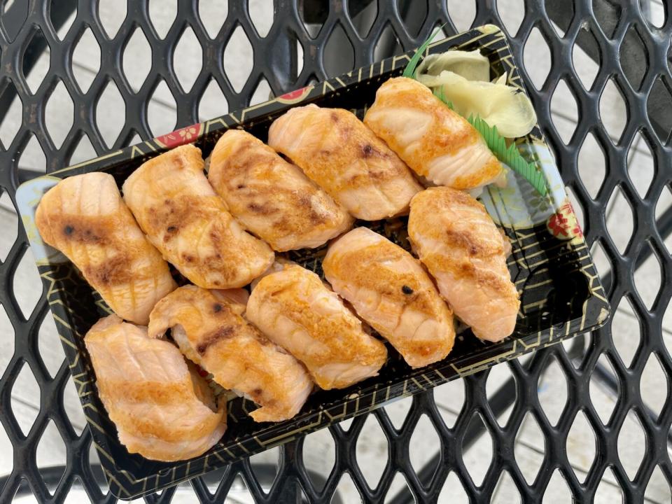 overhead view of 10 pieces of sushi in a sushi container