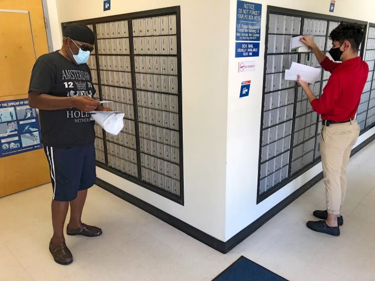 KENDLETON, TEXAS AUGUST 19, 2020 - Franklin Crump, 64, a retired postal worker, checked his mail Wednesday at the post office in Kendleton Wednesday August 19, 2020. Crump, a U.S. Army veteran, plans to vote by mail due to the pandemic and worries the postal service will be overwhelmed. (Molly Hennessy-Fiske / Los Angeles Times)