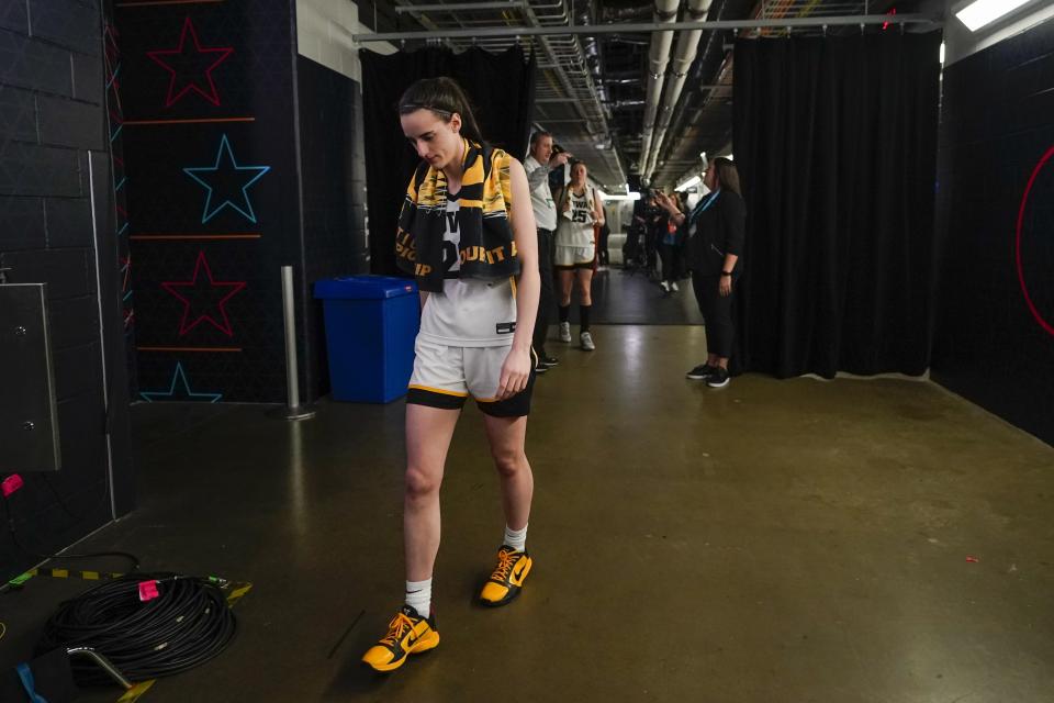 Iowa's Caitlin Clark walks to the locker room after the NCAA Women's Final Four championship basketball game against LSU Sunday, April 2, 2023, in Dallas. LSU won 102-85 to win the championship. (AP Photo/Darron Cummings)