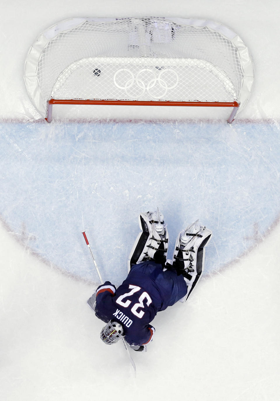 USA goaltender Jonathan Quick lays on the ice after giving up a goal during the third period of the men's bronze medal ice hockey game against Finland at the 2014 Winter Olympics, Saturday, Feb. 22, 2014, in Sochi, Russia. (AP Photo/David J. Phillip )