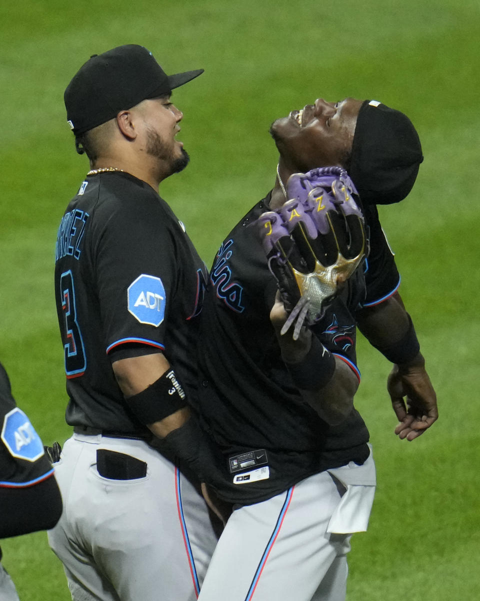 Miami Marlins center fielder Jazz Chisholm Jr., right, celebrates with Luis Arraez after getting the final out of a win over the Pittsburgh Pirates in a baseball game in Pittsburgh, Friday, Sept. 29, 2023. (AP Photo/Gene J. Puskar)