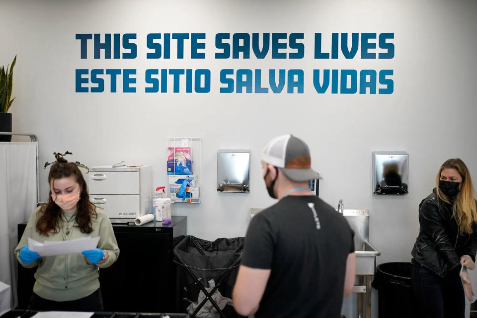 A sign on a wall reads "This site save lives" in Spanish and English at an overdose prevention center at OnPoint NYC in New York on Feb. 18, 2022.