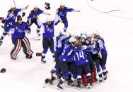 <p>The United States celebrates after defeating Canada in a shootout to win the Women’s Gold Medal Game on day thirteen of the PyeongChang 2018 Winter Olympic Games at Gangneung Hockey Centre on February 22, 2018 in Gangneung, South Korea. (Photo by Harry How/Getty Images) </p>