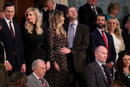 FILE PHOTO: White House advisers Jared Kushner (L) and Ivanka Trump stand with her brother Eric and his wife Lara as well as her brother Donald Trump Jr. and sister Tiffany as they await the start of U.S. President Donald Trump's second State of the Union address to a joint session of the U.S. Congress in the House Chamber of the U.S. Capitol on Capitol Hill in Washington, U.S. February 5, 2019. REUTERS/Jonathan Ernst/File Photo