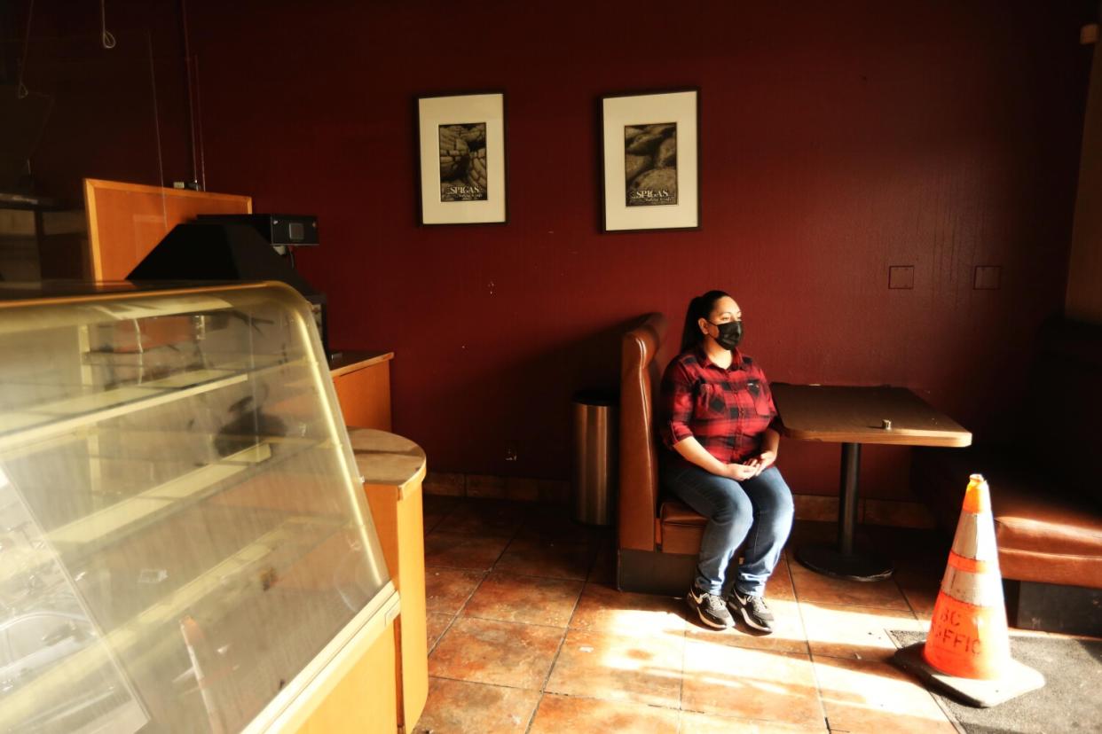 Stephanie Ramirez sits in a booth at Spigas.