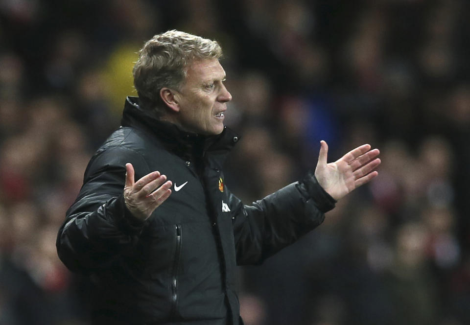 FILE - In this Wednesday, Feb. 12, 2014 file photo Manchester United's manager David Moyes gestures to his team during their English Premier League soccer match between Arsenal and Manchester United at the Emirates stadium in London. Manchester United says manager David Moyes has left the Premier League club after less than a year in charge, amid heavy speculation he was about to be fired. United released a brief statement in its website Tuesday, saying the club "would like to place on record its thanks for the hard work, honesty and integrity he brought to the role." (AP Photo/Alastair Grant, File)