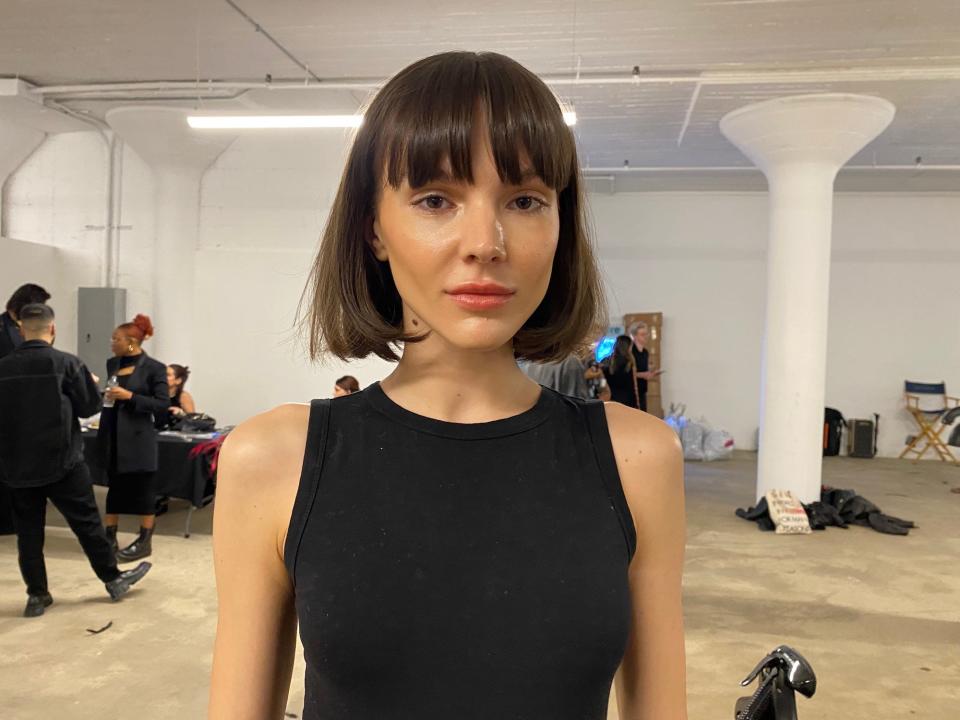 A model with completed makeup at Christian Cowan's Fall/Winter 2023 show.