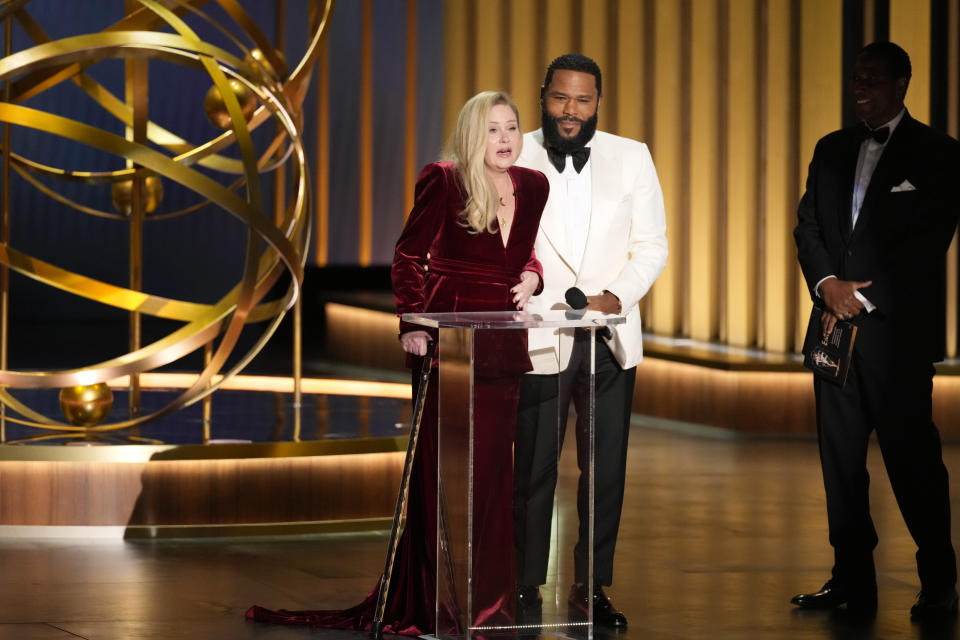 Christina Applegate, left, presents the award for outstanding supporting actress in a comedy series during the 75th Primetime Emmy Awards on Monday, Jan. 15, 2024, at the Peacock Theater in Los Angeles. (AP Photo/Chris Pizzello)