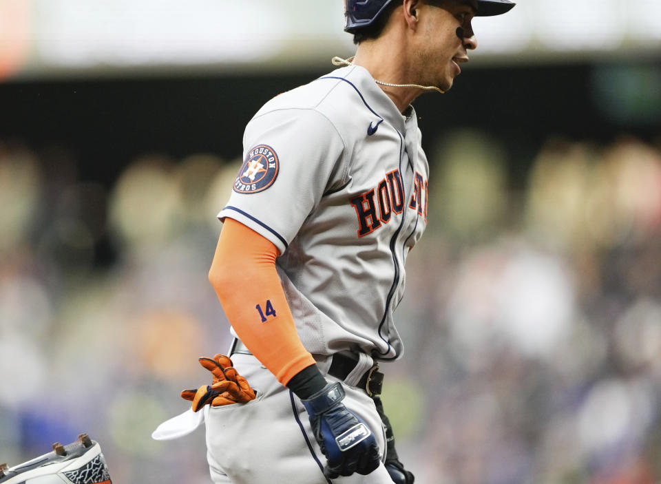 Houston Astros' Mauricio Dubon runs home to score on a sacrifice fly by teammate Kyle Tucker against the Seattle Mariners during the fourth inning of a baseball game Saturday, May 6, 2023, in Seattle. (AP Photo/Lindsey Wasson)