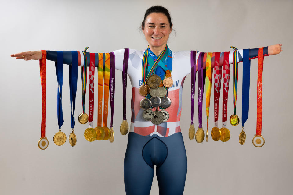 DISLEY, ENGLAND - JUNE 16: Dame Sarah Storey poses with  her 28 Paralympic medals on June 19, 2024 in Disley, England. Dame Sarah Storey is the most successful British Paralympic athlete of all time with 28 medals including 17 gold, 8 silver and 3 bronze. At the age of 14 Sarah made her maiden Paralympic appearance competing as a swimmer in Barcelona, switching to cycling in 2005. At the age of 46 Paris will be her 9th Paralympic games. (Photo by Michael Steele/Getty Images)