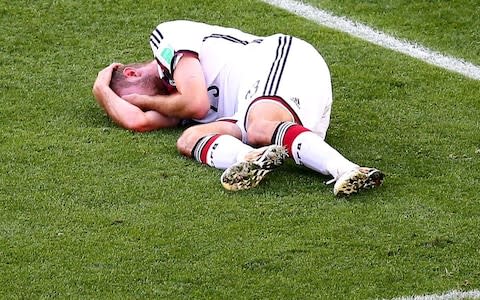 Christoph Kramer of Germany lies on the pitch after a collision during the 2014 FIFA World Cup Brazil Final match between Germany and Argentina at Maracana on July 13, 2014 in Rio de Janeiro, Brazil - Credit:  Getty Images 