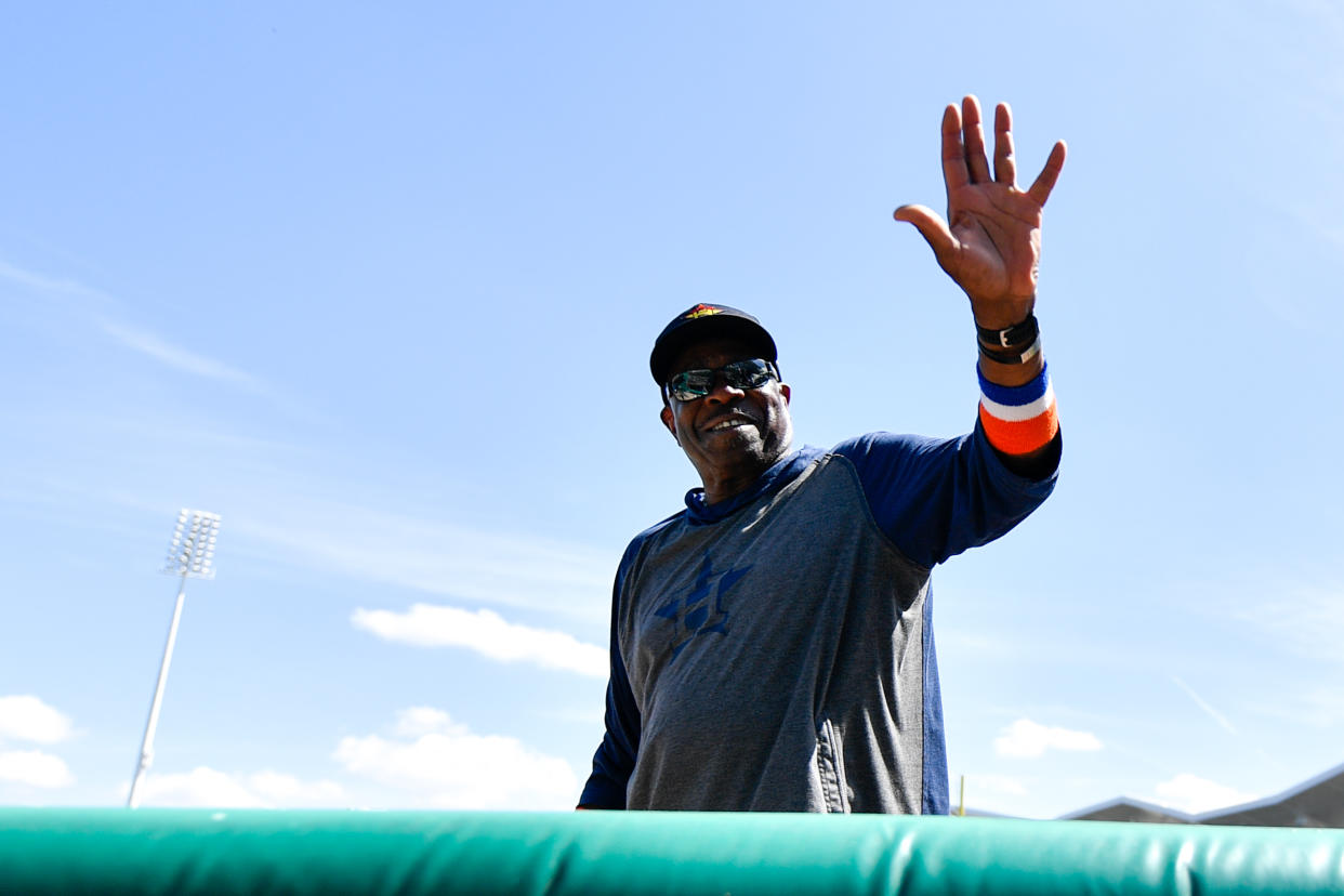 Mar 5, 2020; Fort Myers, Florida, USA; Houston Astros manager Dusty Baker (12) waves to fans prior to the game against the Boston Red Sox during spring training at JetBlue Park. Mandatory Credit: Douglas DeFelice-USA TODAY Sports