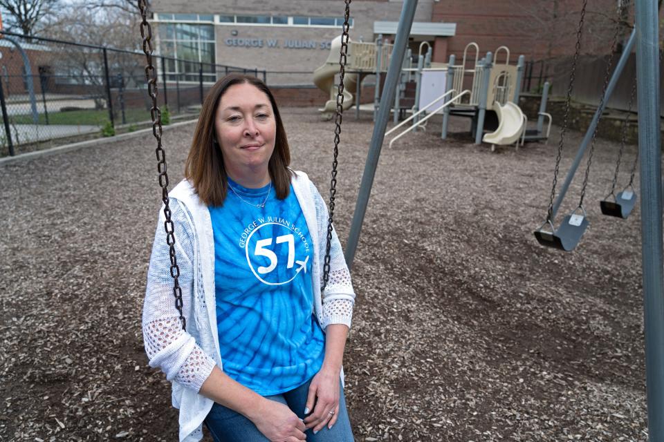 Cassandra Crutchfiield sits on a swing Tuesday, April 12, 2022 at George Julian School 57.