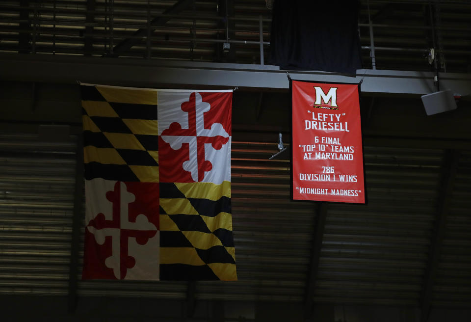 FILE - A banner honoring former Maryland men's basketball coach Lefty Driesell hangs from the rafters after being unveiled before an NCAA college basketball game between Maryland and Ohio State, Saturday, Feb. 11, 2017, in College Park, Md. Lefty Driesell, the coach whose folksy drawl belied a fiery on-court demeanor that put Maryland on the college basketball map and enabled him to rebuild several struggling programs, died Saturday, Feb. 17, 2024. He was 92. (AP Photo/Patrick Semansky, File)