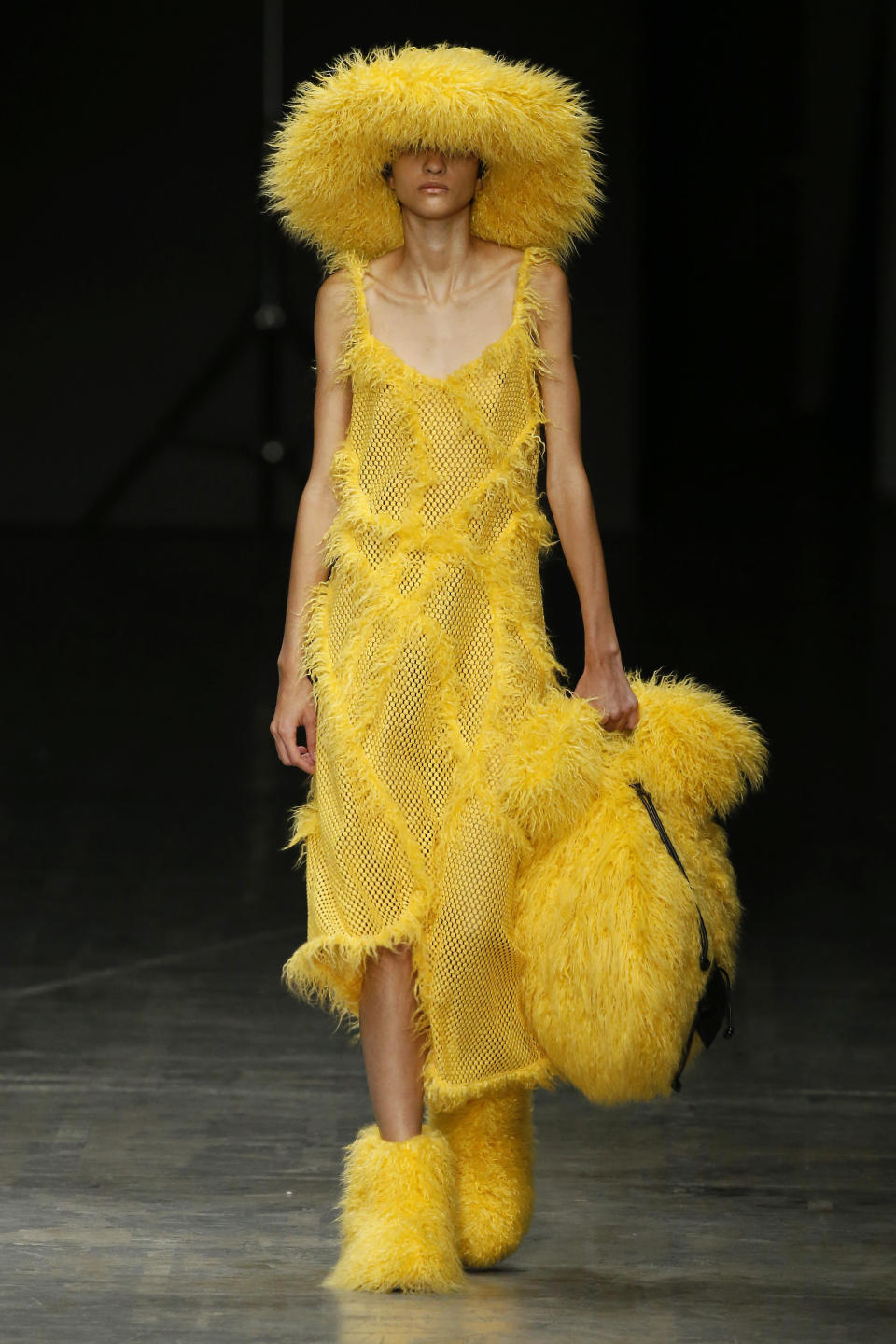 Angel Chen presented some Big Bird realness at her show during Milan Fashion Week. To be honest, each of the pieces would be pretty fun on its own, but as a whole, that's <i>a lot</i> of yellow.&nbsp;