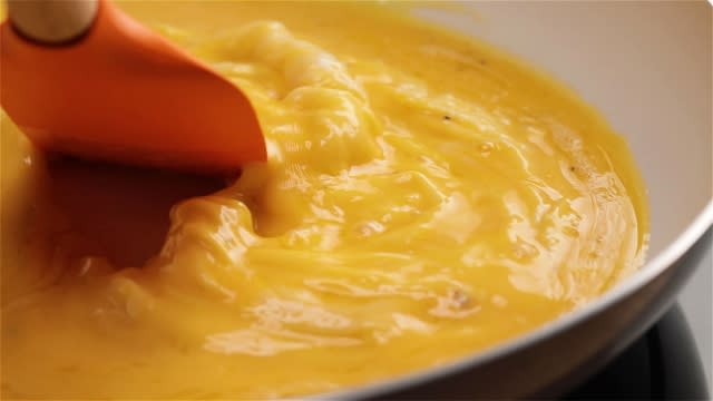 make scramble eggs with milk and butter and pushing it inwards