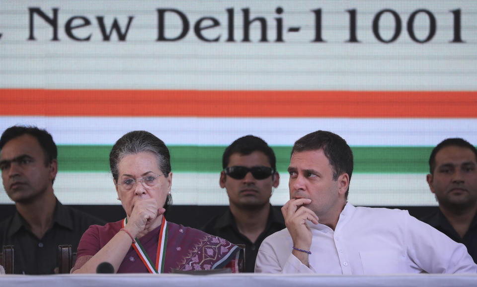 In this in April 2, 2019, photo, United Progressive Alliance Chairperson Sonia Gandhi, second left, sits with her son and Congress Party President Rahul Gandhi, second right, at the India National Congress party headquarters to release its manifesto for the upcoming general election, in New Delhi, India. Jawaharlal Nehru, his daughter Indira Gandhi and her son Rajiv Gandhi ruled the country for about a half a century cumulatively after India won independence from Britain in 1947. Rajiv Gandhi's son, Rahul Gandhi, is now the Congress party leader and a potential candidate for prime minister if the opposition can stitch an alliance to stop the Modi juggernaut. (AP Photo/Manish Swarup)