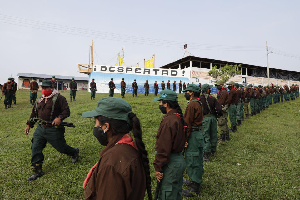 Members of the Zapatista Army of National Liberation, EZLN, wait to say farewell to a delegation that will leave for Europe on May 3, in the community of Morelia, Chiapas state, Mexico, Monday, April 26, 2021. The rebels say they are planning to take canoes on a trip to ‘invade’ Spain in May and June, as Mexico marks the anniversary of the 1519-1521 Spanish Conquest of Mexico. (AP Photo/Eduardo Verdugo)