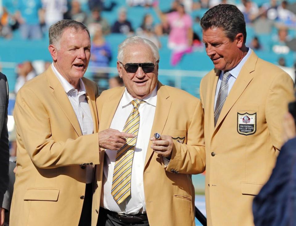 Hall of Fame coach Don Shula is presented with a new Hall of Fame ring at half time. Shula is flanked by fellow Dolphin Hall of Famers Bob Griese, left, and Dan Marino, right, as the Miami Dolphins host the Dallas Cowboys at Sun Life Stadium on Sunday, November 22, 2015