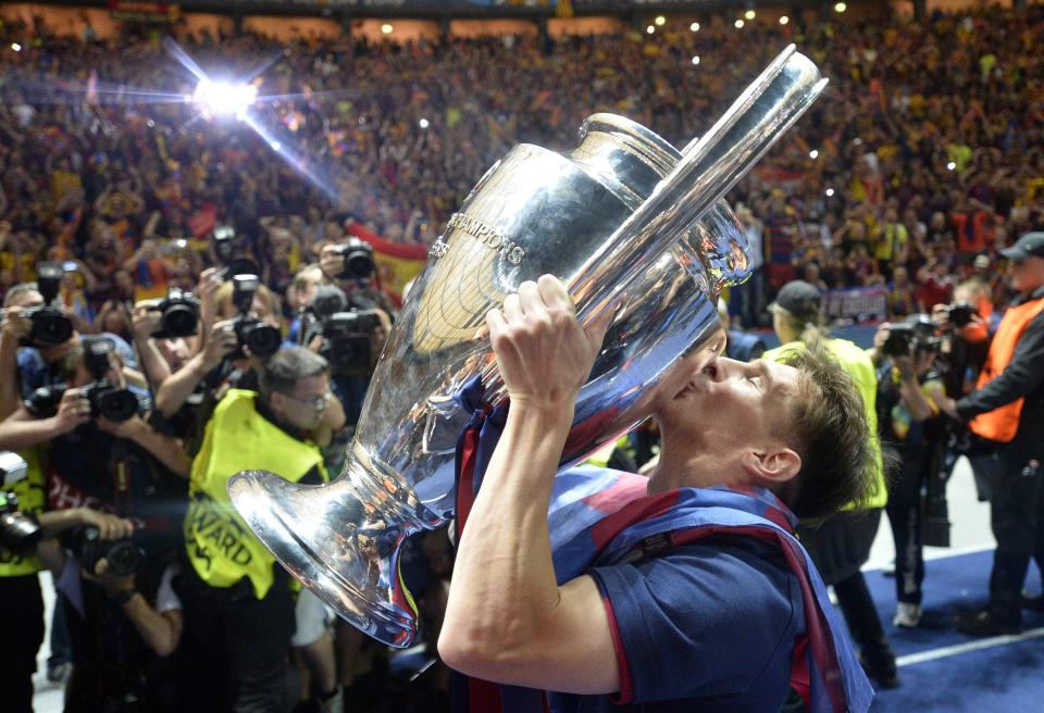 FILE - Barcelona's Lionel Messi kisses the trophy after his team won 3-1 in the Champions League final soccer match between Juventus Turin and FC Barcelona at the Olympic stadium in Berlin, June 6, 2015. Lionel Messi says he is coming to Inter Miami and joining Major League Soccer. After months of speculation, Messi announced his decision Wednesday, June 7, 2023,to join a Miami franchise that has been led by another global soccer icon in David Beckham since its inception but has yet to make any real splashes on the field.(AP Photo/Martin Meissner, file)