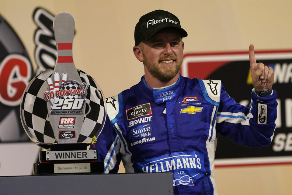 Justin Allgaier celebrates in Victory Lane after winning a NASCAR Xfinity Series auto race Friday, Sept. 11, 2020, in Richmond, Va. (AP Photo/Steve Helber)