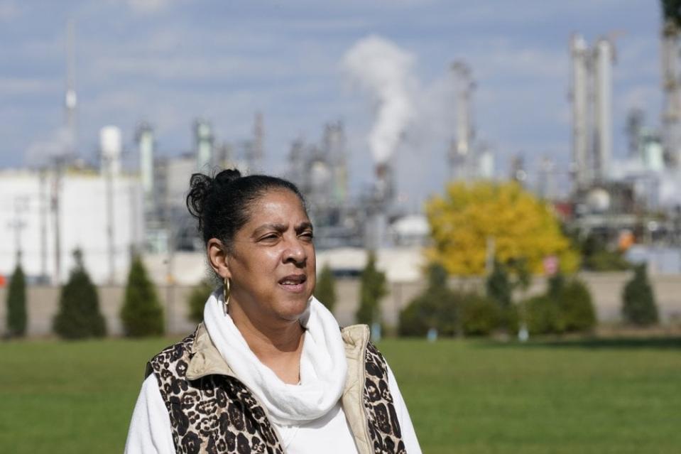 Theresa Landrum is photographed near the Marathon refinery, Friday, Oct. 16, 2020, in Detroit. Landrum wasn’t impressed when told that Environmental Protection Agency chief Andrew Wheeler had pledged $200,000 to promote “community health initiatives” in her section of the city during his blitz of visits to battleground states in the presidential election campaign. (AP Photo/Carlos Osorio)