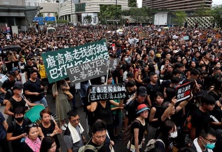 FILE PHOTO: A sign that reads "Be water" is seen as anti-extradition bill protesters march to West Kowloon Express Rail Link Station at Hong Kong's tourist Tsim Sha Tsui district