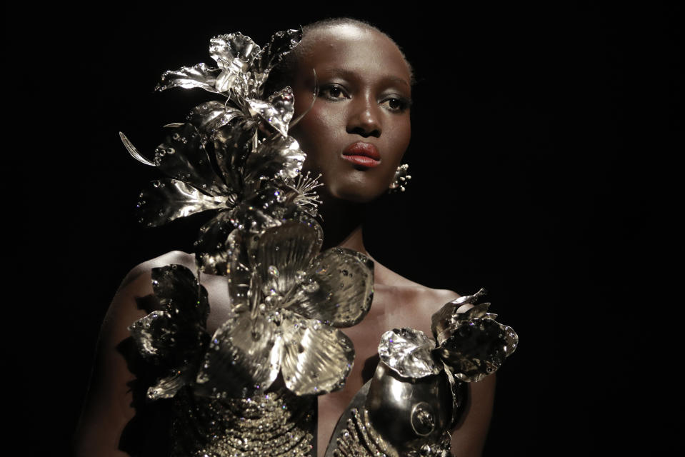 A model wears a creation for Schiaparelli's Haute Couture Fall/Winter 2022-2023 fashion collection, Monday, July 4, 2022 in Paris. (AP Photo/Lewis Joly)