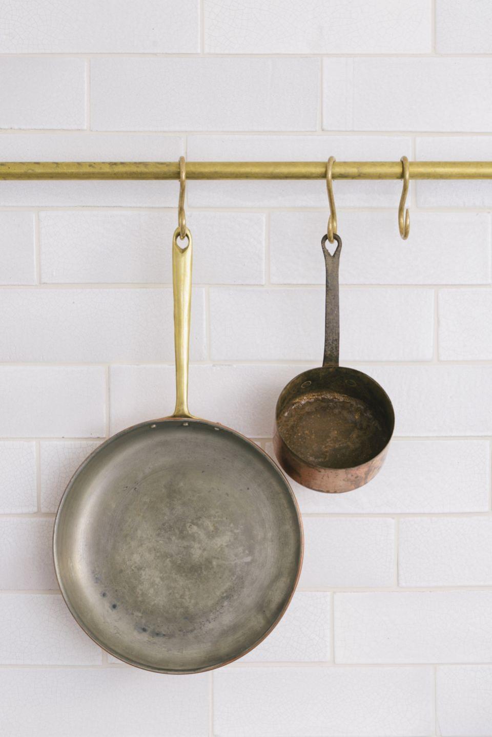 1) Brass hanging rail and hooks by Devol