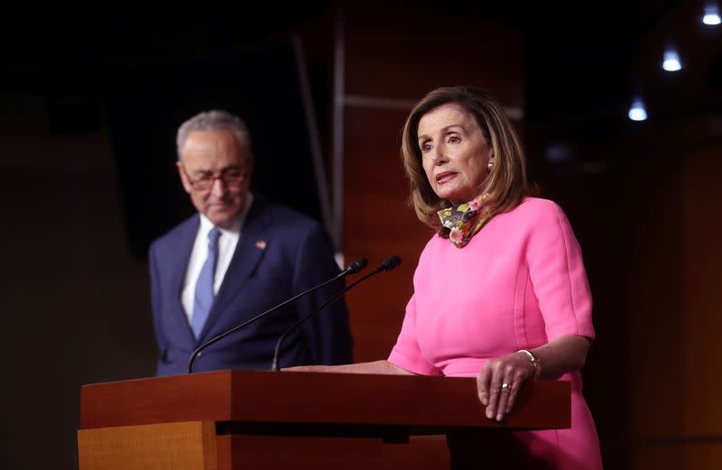 U.S. House Speaker Nancy Pelosi (D-CA), speaks next to Senate Minority Leader Chuck Schumer (D-NY), during a news conference on Capitol Hill in Washington