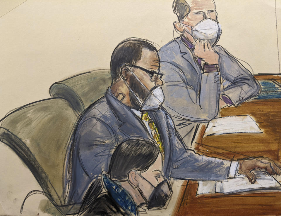 In this courtroom sketch, R. Kelly, center, sits with his defense attorneys Thomas Farinella, top, and Nicole Blank Becker during the first day of his defense in his sex trafficking case, Monday, Sept. 20, 2021, in New York. (AP Photo/Elizabeth Williams)