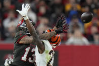 Tampa Bay Buccaneers wide receiver Mike Evans (13) misses the catch as Cincinnati Bengals safety Dax Hill (23) defends during the second half of an NFL football game, Sunday, Dec. 18, 2022, in Tampa, Fla. (AP Photo/Chris O'Meara)