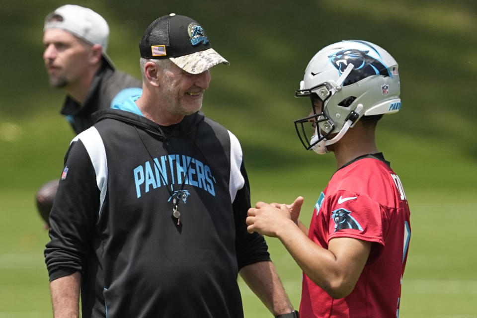 Panthers head coach Frank Reich (left) says Andy Dalton is the starting quarterback right now. Bryce Young, the first overall pick in the draft, figures to take that mantle sooner than later. (AP Photo/Chris Carlson)