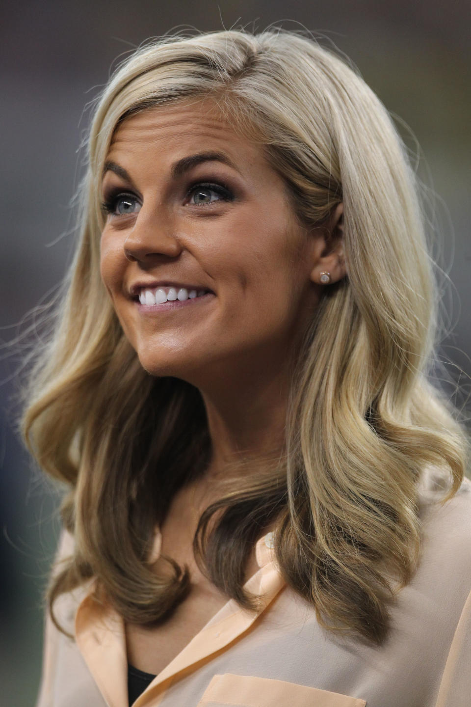 Samantha Steele smiles while reporting on a game between Michigan and Alabama. (US Presswire)