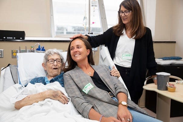 Virginia Stevens in the Vanderbilt Medical Palliative Care unit with daughter Karen Kreager, standing, and granddaughter Catherine Adkins.