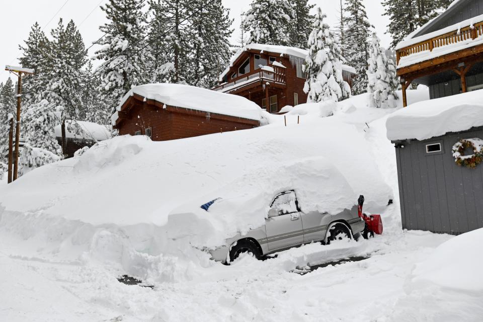 A vehicle is buried in snow in a Donner Lake neighborhood on Monday, March 4, 2024, in Truckee, Caliornia.