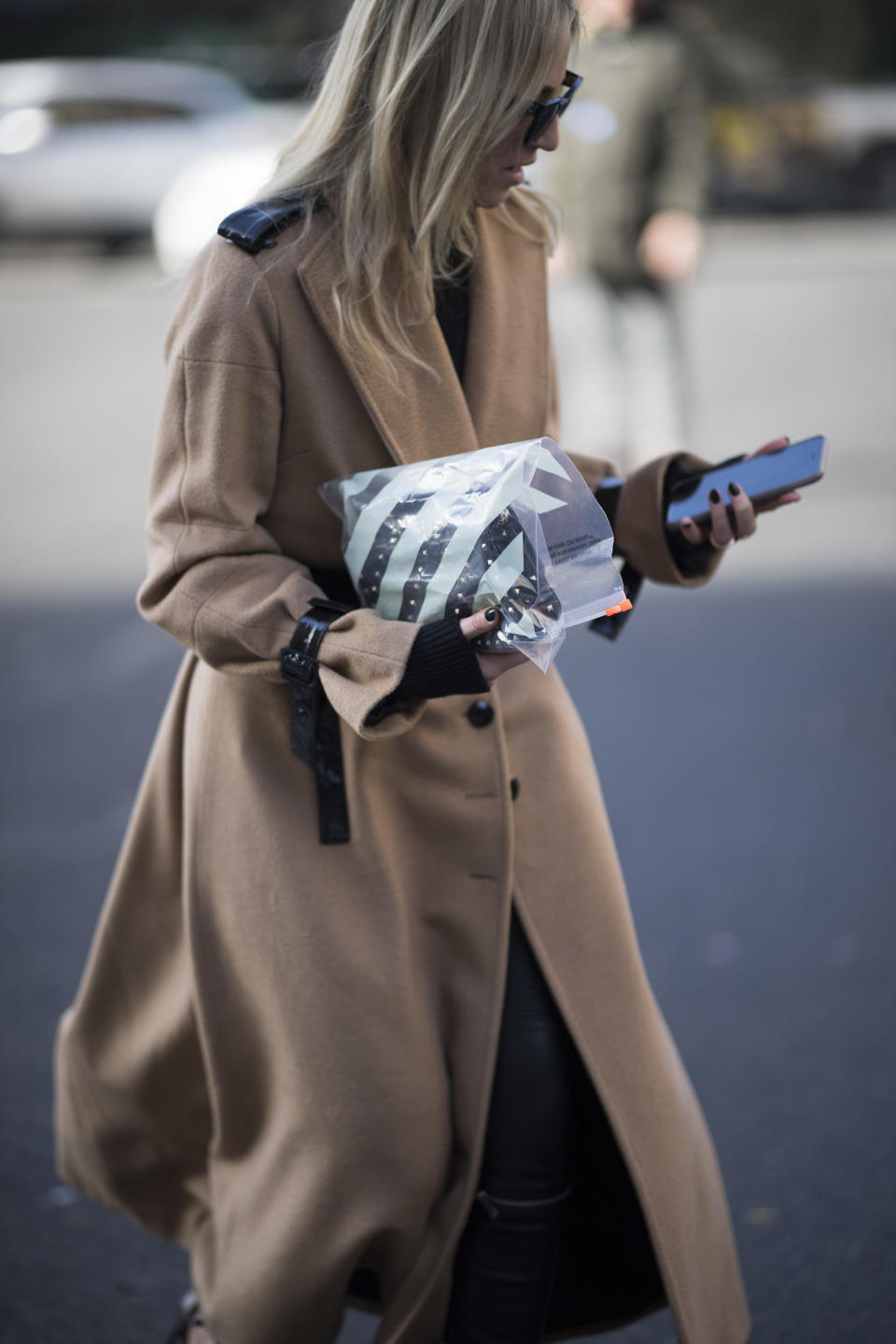 <p>Model carries an Off-White clear plastic zip bag. (Photo: Getty Images) </p>