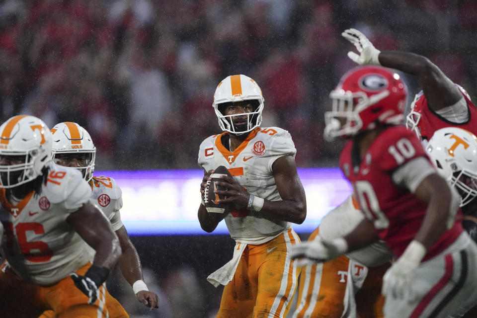 Tennessee quarterback Hendon Hooker (5) looks for an open receiver during the second half of an NCAA college football game against Georgia, Saturday, Nov. 5, 2022 in Athens, Ga. (AP Photo/John Bazemore)