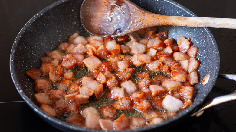 chopped bacon in frying pan