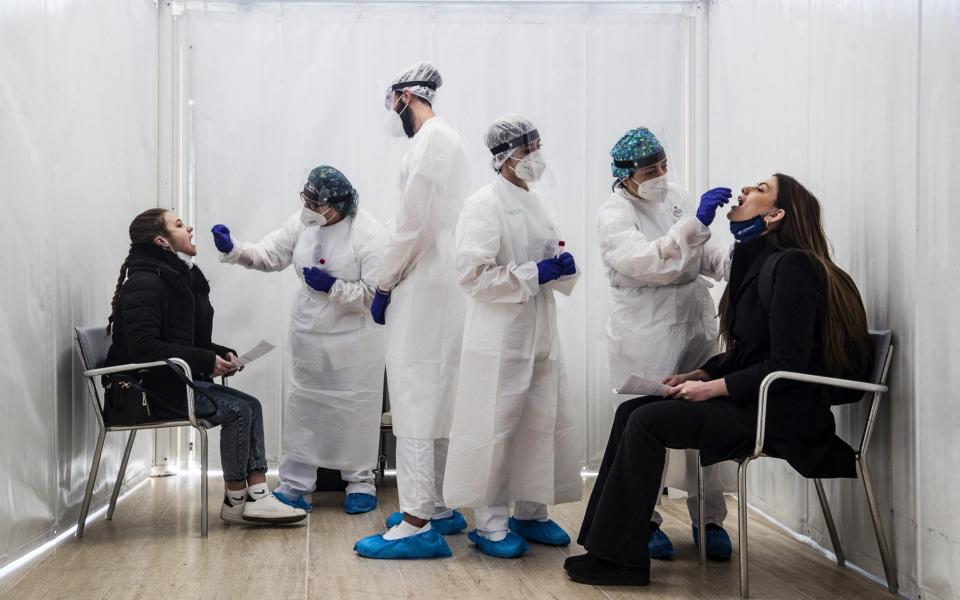 Healthcare professionals perform Covid-19 swab tests on students of the University 'La Sapienza' of Rome - ANGELO CARCONI/EPA-EFE/Shutterstock 