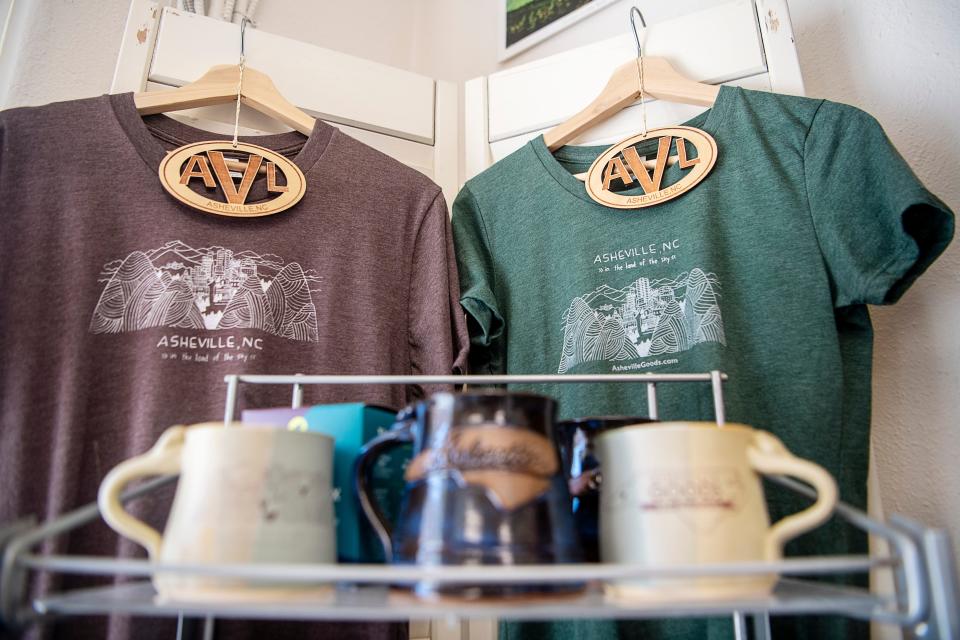 Shirts, ornaments, and mugs for sale at Asheville Goods.
