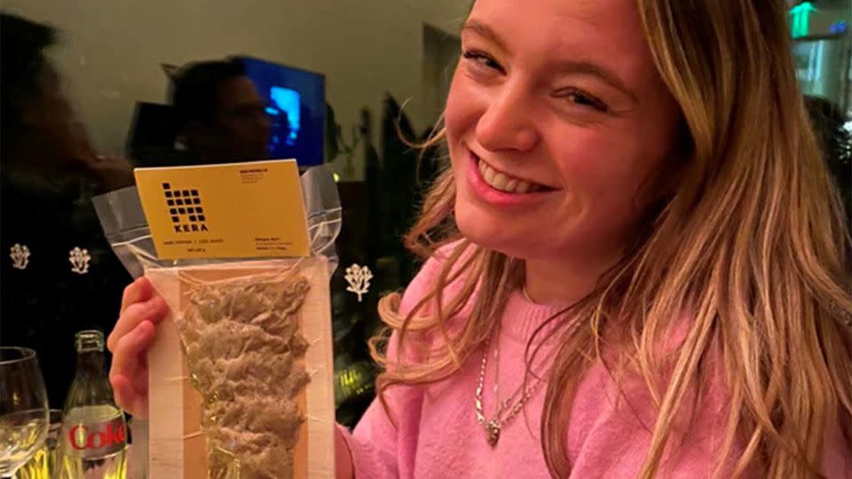 CNN's Leah Collins holds a sample of the Kera chicken-feather protein product at the tasting event in London on April 4, 2024. - Leah Collins/CNN